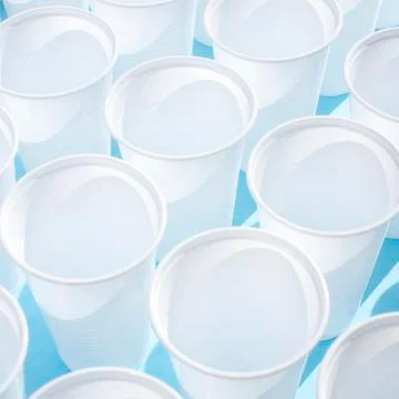 Disposable plastic white empty cups Stock Photos