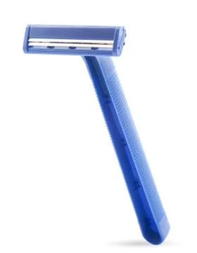 Disposable razor close-up on a white background. Stock Photos