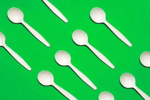 Disposable spoons of corn starch . biodegradable  tableware. Stock Photos