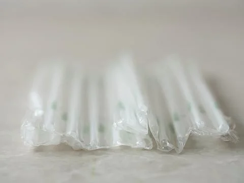 Disposable straws on marble background Stock Photos