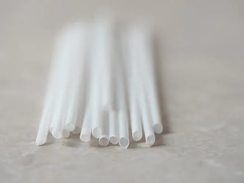 Disposable straws on marble background Stock Photos