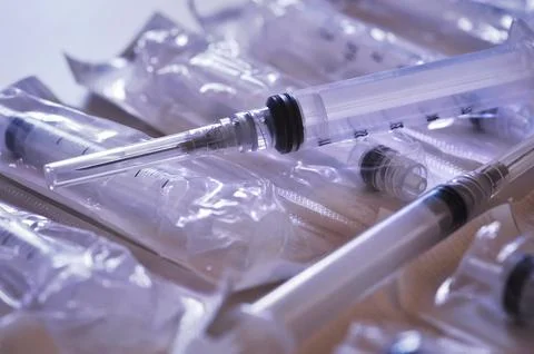 Disposable syringes inside the packaging Stock Photos