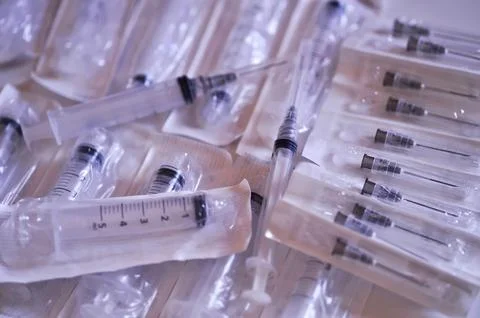 Disposable syringes inside the packaging Stock Photos