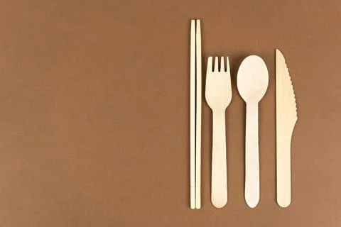 Disposable tableware made of natural materials, a knife, a wooden fork Stock Photos