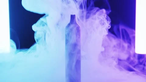 Disposable Vape Pen Surrounded by Vapor with Neon Lights Video stock 326314339