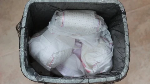 Disposing of poopy diapers Stock Footage 85775823