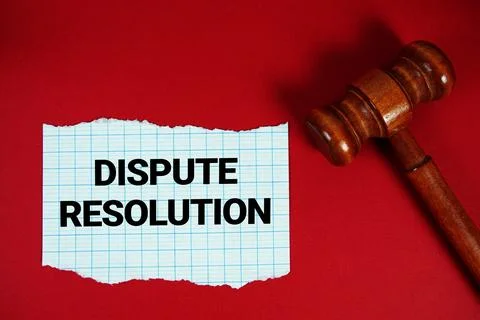 Dispute Resolution text written on rip paper with wooden judgment gavel on .. Foto stock