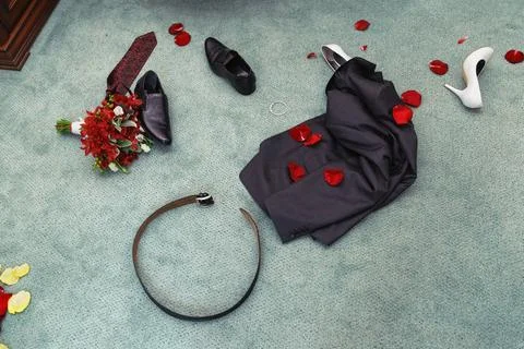 Disrobed wedding clothes. straggle objects. Shues, suit, bouquet, belt, ne... Stock Photos