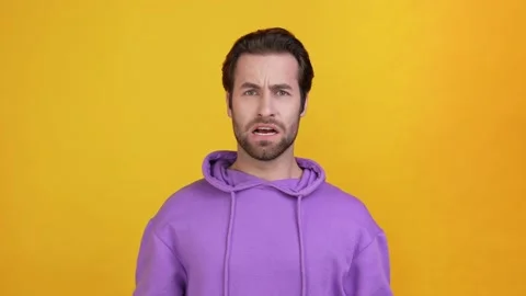 Dissatisfied guy shout rage hands up isolated bright color background Stock Footage 165863294