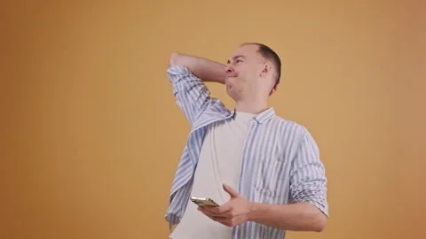 Dissatisfied man express bad luck or failure after interaction with smartphone Stock Footage 289103821