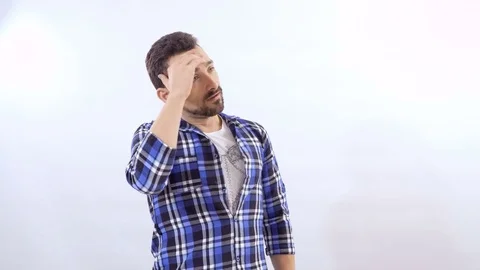 Dissatisfied man at white background Stock Footage 83751285