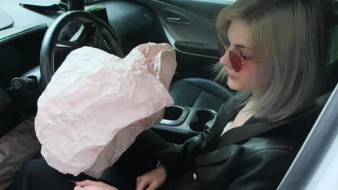 Dissatisfied young blonde lady hits inflated safety cushion Stock Footage 280176582