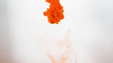 The dissolution paints in water. Orange on white background. Stock Footage 108269141