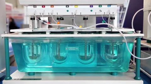 Dissolution testing with USP method equipment in laboratory Stock Footage 52583084