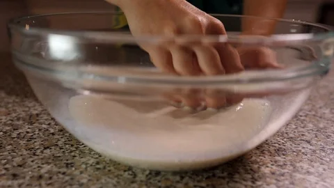 Dissolve the yeast in the milk slow motion Stock Footage 96233878