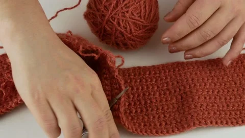 Dissolves the associated pattern.Detangles loops with small scissors. Stock Footage 140894883