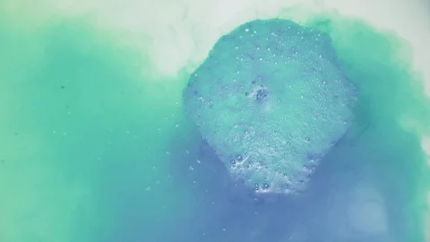 Dissolving the blue salt bomb Stock Footage 129574013