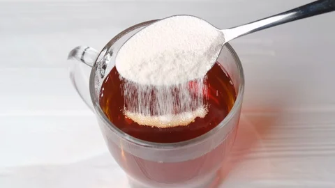 Dissolving collagen powder in tea Stock Footage 129216073