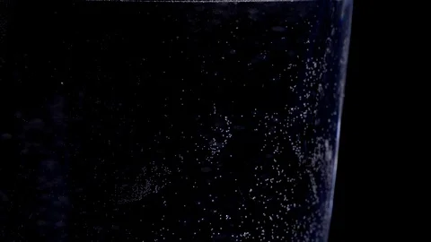 Dissolving an effervescent tablet in a glass of water. Stock Footage 117528691