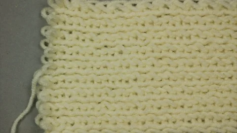 Dissolving knitted background. Place for text. Stop motion Stock-Footage 125637516