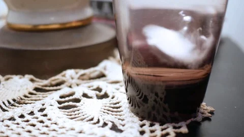 Dissolving medical tablet drops into water glass on bedstand ALT Stock Footage 82243239