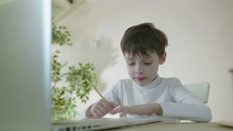 Distance education online learning lesson concept. Child Little school Boy Kid Stock Footage 186966147
