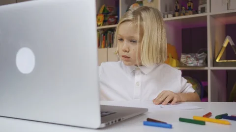 Distance learning online education. A pre school boy learning at home in a kids Stock Footage 128580852