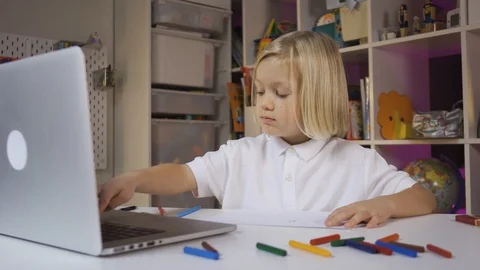 Distance learning online education. A pre school boy learning at home in his Stock Footage 128580882