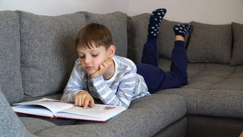 Distance learning online education. School kid in self isolation using tablet Stock Footage 128982856