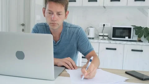 Distance learning, online lesson. Focused smart adult male student studying Stock Footage 255139865