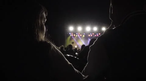 Distance. So close, far away. Two people at the concert. Longing. Loneliness Stock Footage 68833866