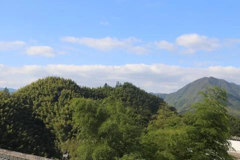In the distance, there is an undulating mountain range covered with a green.. Stock Photos