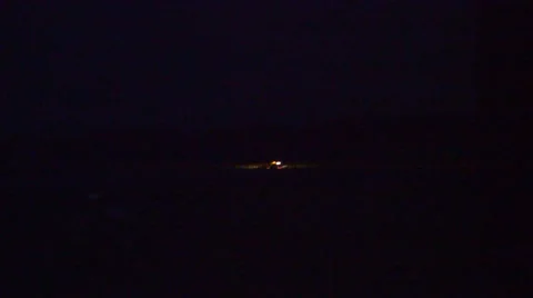 In the distance tractor drivnig at night Stock Footage 41462091