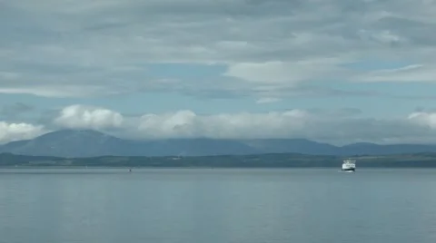 Distance view of a Caledonian MacBrayne Ferry crossing the Clyde, Scotland Stock Footage 51444125