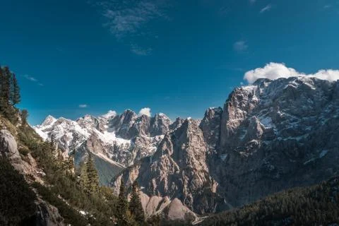 A distance view on massive, sharp rocky mountain range Stock Photos