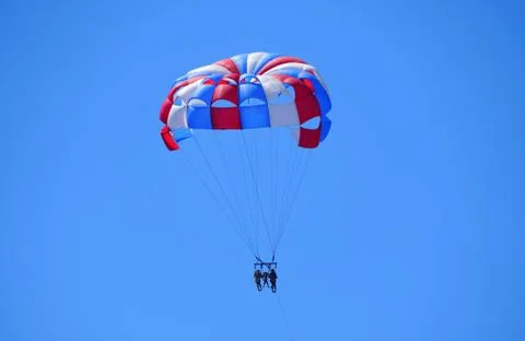 A distance view of parasailing excursion on a bright sunny day near near Made Fotos Stock