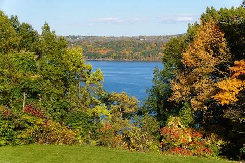 A distance water view with the background of fall foliage near Cayuga Lake,.. Stock Photos