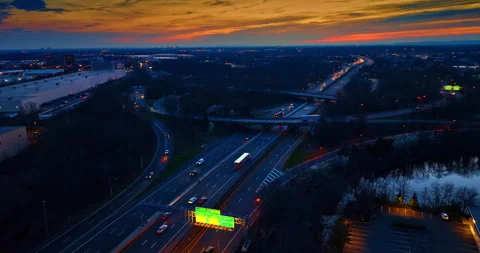 Distancing from the lively intersection. Lots of cars move by the roads, loops Stock Footage 333512912