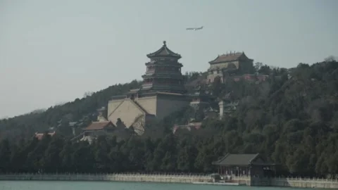 Distant Airplane Flying Over Summer Palace Temples and Hillside in Beijing China Stock Footage 341781081