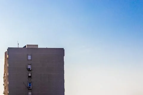 A distant architectural shoot from a building with clear sky as background Stock Photos