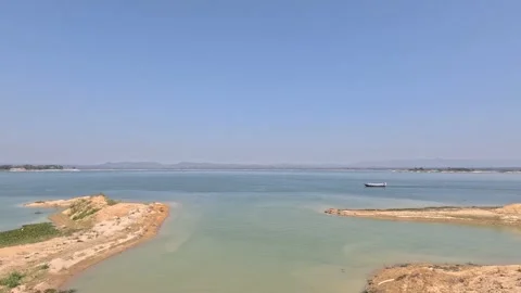 A distant boat passing through the Kaptai lake in Rangamati Chittagong Stock Footage 272146897