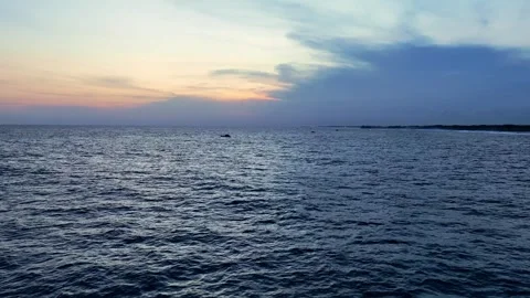 Distant boat on peaceful evening ocean Stock Footage 335440669