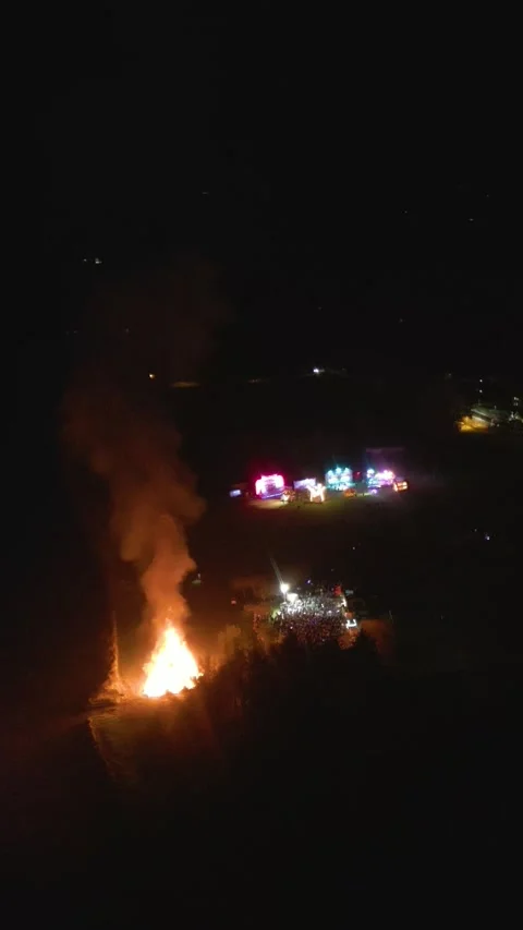 Distant bonfire local fair tain scotland smoke flames create scene crowd enjoys 動画素材 296321734