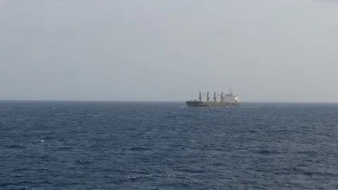 Distant bulk carrier ship on vast empty horizon Video stock 109131141