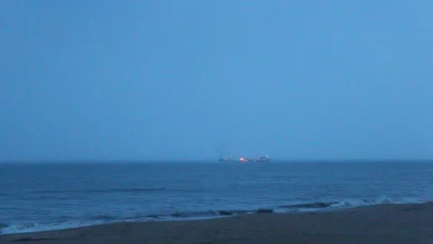 Distant Cargo Ship On Horizon Seen Through Ocean Mist Stock Footage 106673715