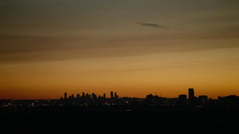 Distant city sunset skyline Stock Footage 161781986