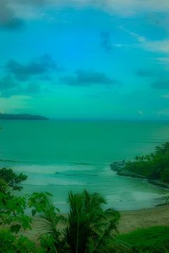 Distant coastal view from elevated  perspective with beach and ocean horizon Stock Photos