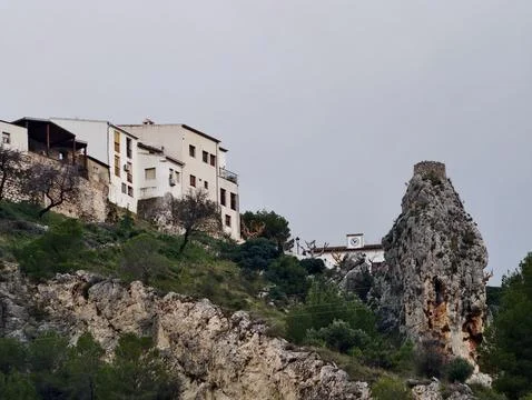 Distant community located along rugged cliffs featuring ageold buildings an.. Stock Photos