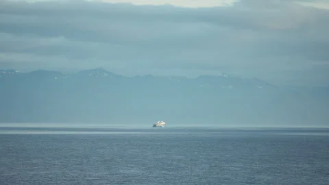 Distant cruise ship below misty mountains in Alaska Stock-Footage 348016589