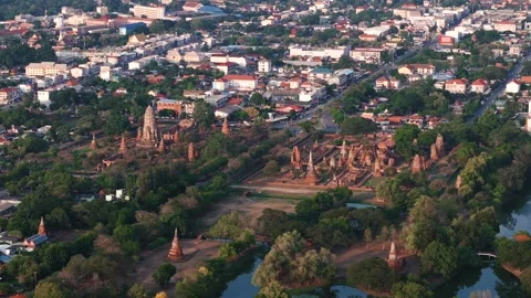 Distant drone view of the ancient ruins of Wat Ratchaburana and Wat Mahathat in Stock Footage 312538352